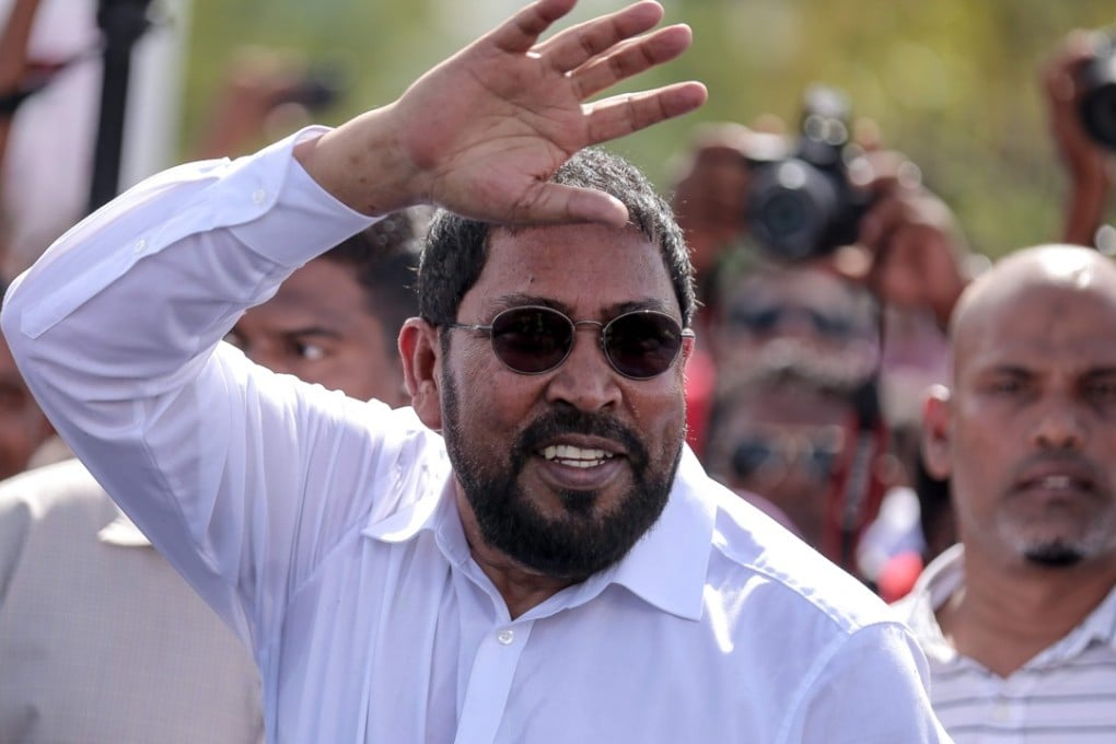 Opposition leader Qasim Ibrahim arrives at Velana International Airport in Male, Maldives. Photo: AFP