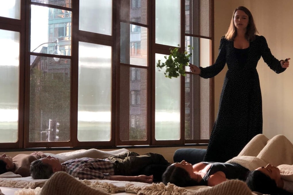 Deborah Hanekamp, the shaman-trained owner of Mama Medicine, performs what she calls a medicine reading for visitors to Washington’s Eaton Workshop hotel. Photo: The Washington Post