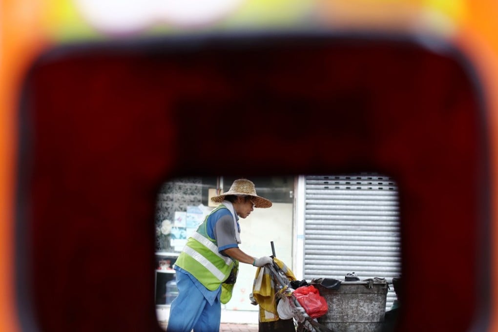 Cleaners like 70-year-old Wang Sim-nui currently earn the minimum wage of HK$36 (US$4.59) per hour. Photo: Nora Tam