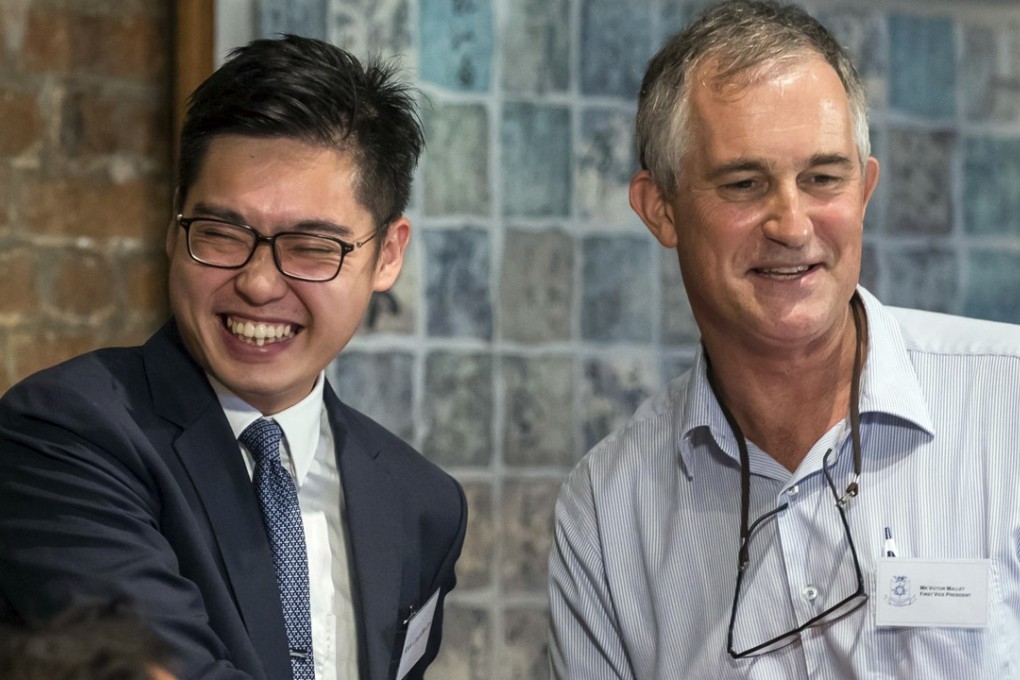 Andy Chan (left) from the Hong Kong National Party shakes hands with Victor Mallet at the Foreign Correspondents’ Club. Photo: K.Y. Cheng