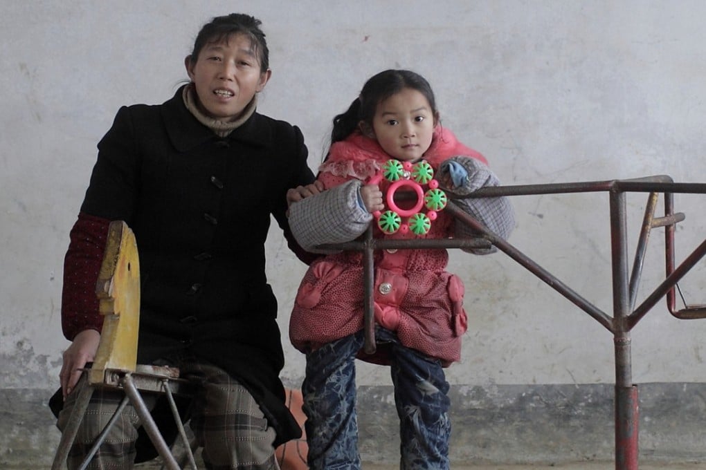 An image from Fu Yongjun’s award-winning 2012 portrait series depicting children in the village of Zhangmu, Chongqing, with their teacher, Fu Huaying. Photo: Handout