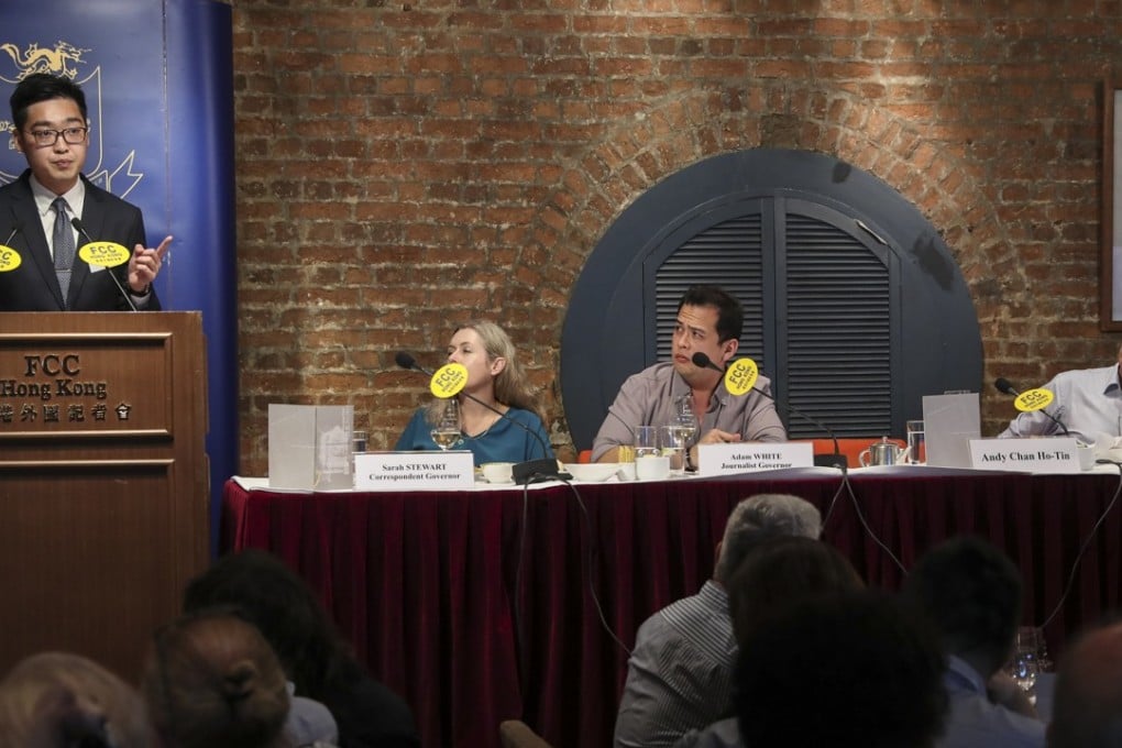 Victor Mallet (seated far right) looks on as Andy Chan Ho-tin (left) gives his controversial speech at the FCC. Photo: K. Y. Cheng