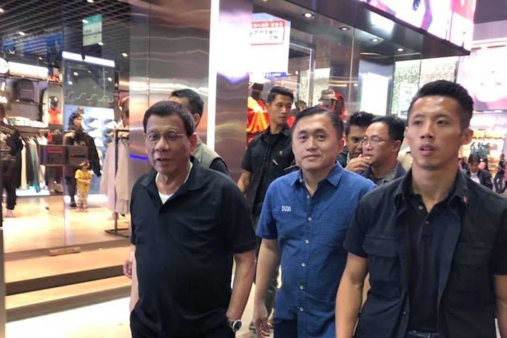 Philippine President Rodrigo Duterte (left) in Hong Kong on Saturday night with his special assistant, Christopher Bong Go (centre) and members of his security detail. Photo: Christopher Bong Go