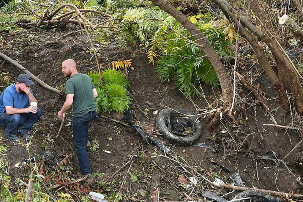 Distraught family members take in the scene in Schoharie, New York, on Sunday, one day after an accident left 20 people dead. Photo: Albany Times Union