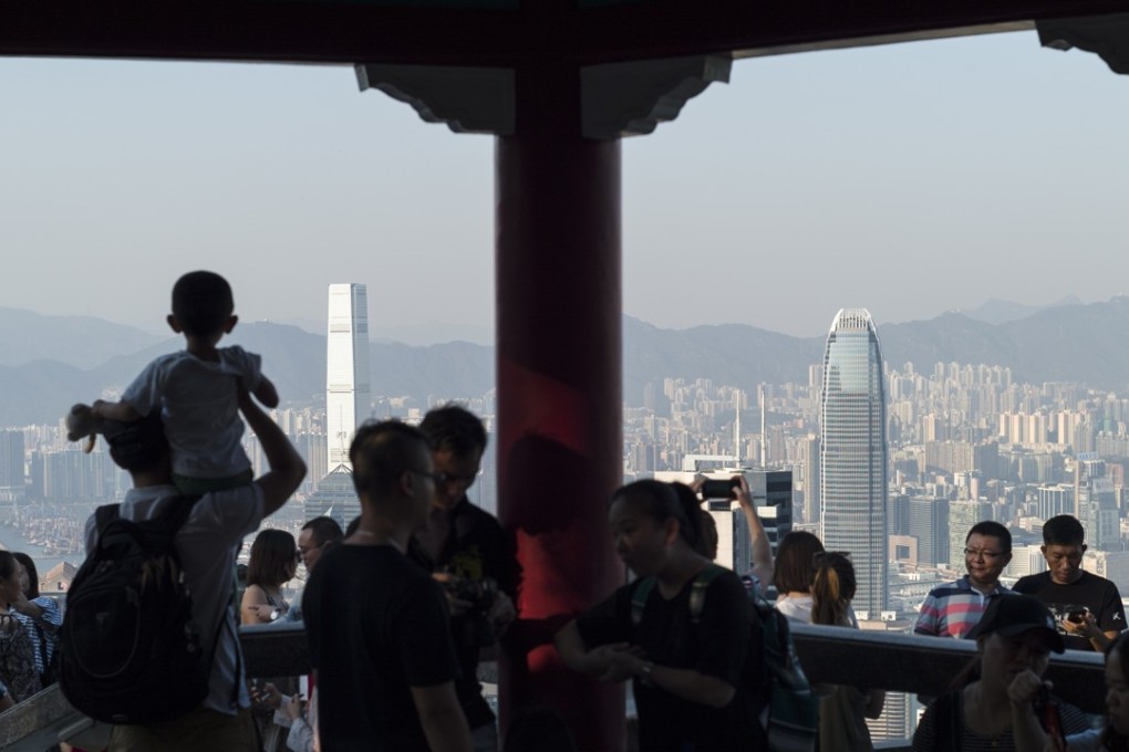 Chinese tourists visit Victoria Peak in Hong Kong during the mainland’s ‘golden week’ holiday. Asset managers in Asia reported US$66 billion in revenue last year, according to McKinsey. This number is expected to grow to US$112 billion over the next five years. Photo: EPA-EFE