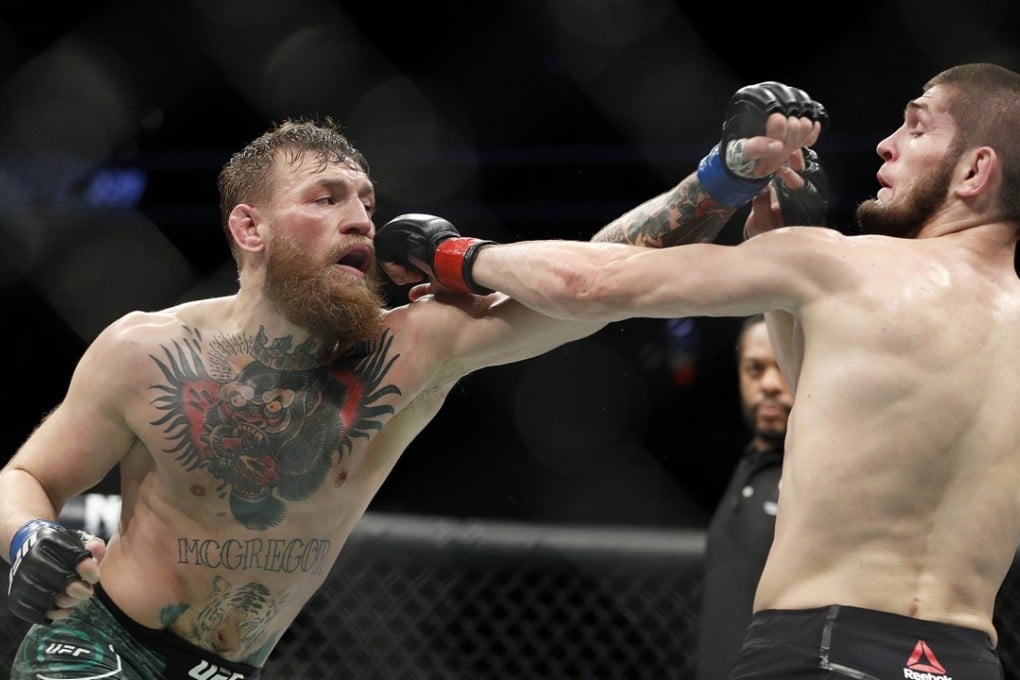 Conor McGregor throws a punch at Khabib Nurmagomedov during UFC 229 in Las Vegas. Photo: AP