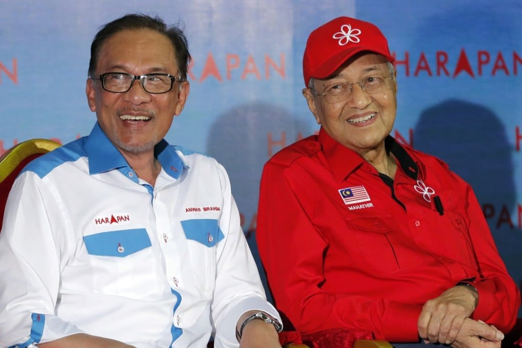 Anwar Ibrahim alongside Malaysia’s Prime Minister Mahathir Mohamad during a rally in Port Dickson. Photo: AP