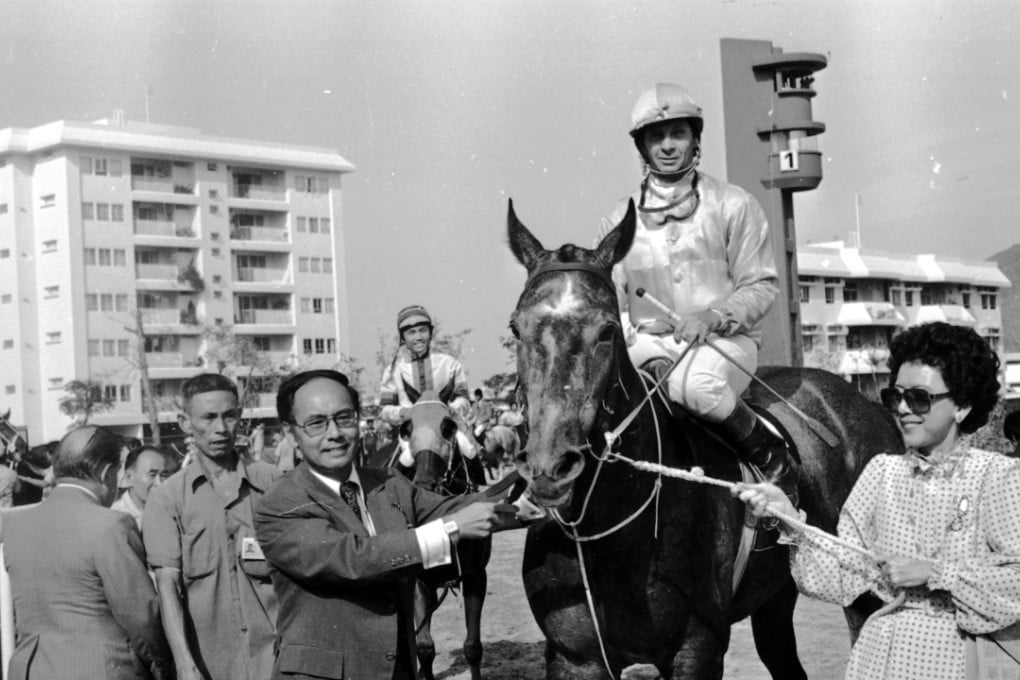 Sanford and Marlene Yung lead Silver Lining, ridden by Bill Hartack, after winning the Sha Tin Trophy on the opening day of Sha Tin Racecourse. Pictures: SCMP