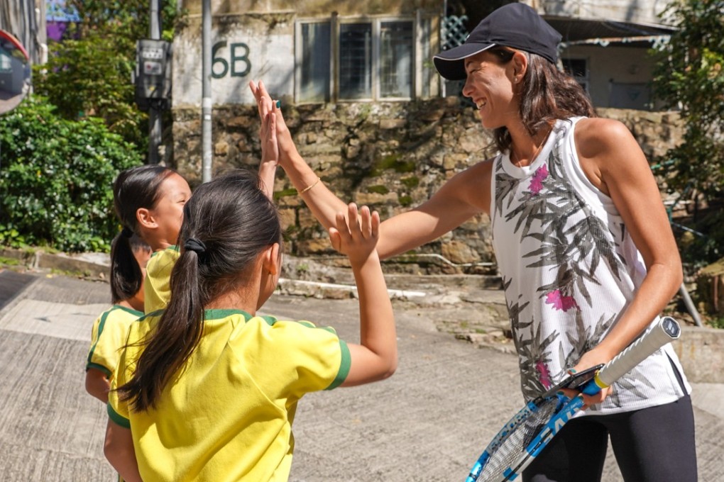 Garbine Muguruza plays tennis with schoolchildren from Shaukiwan Tsung Tsin School. Photos: Handout