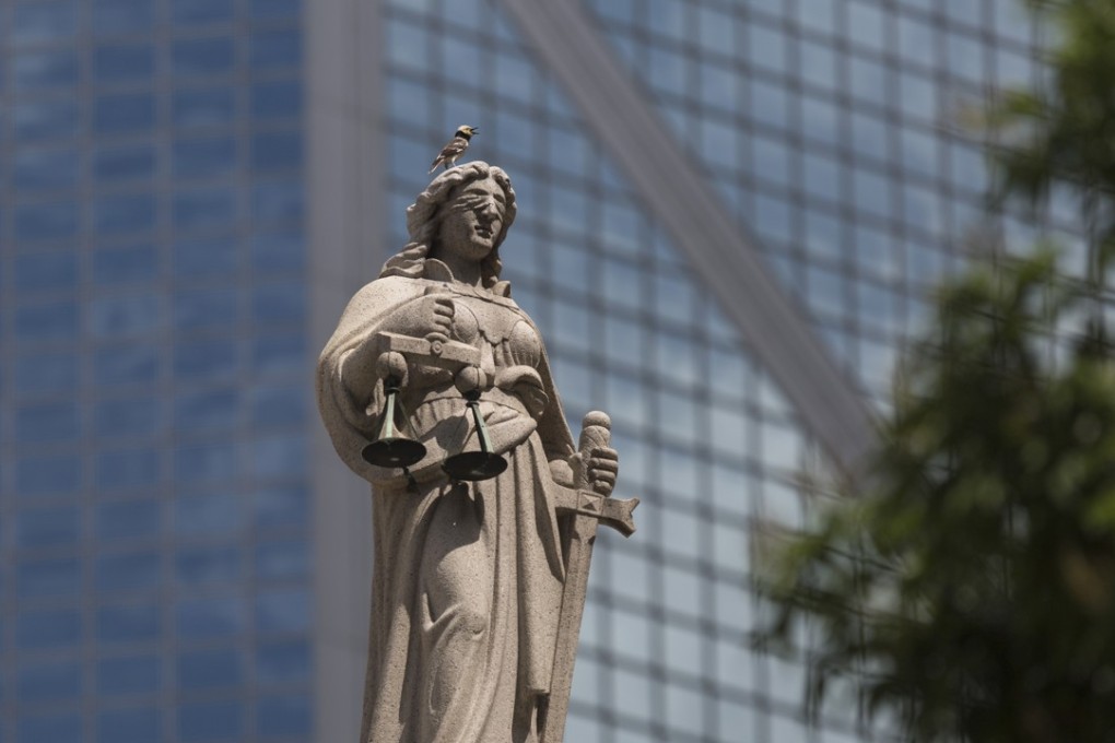A statue representing Justice is displayed on the Court of Final Appeal in Hong Kong. Photo: EPA