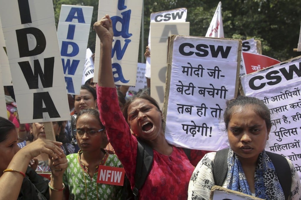Activists condemn the rape of a 19-year-old woman, in Rewari in Haryana state, during a protest in New Delhi. Photo: AP
