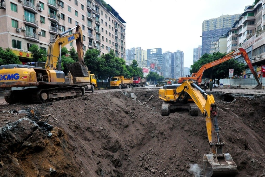 Excavators at the site of the massive sinkhole in Sichuan. Photo: Reuters