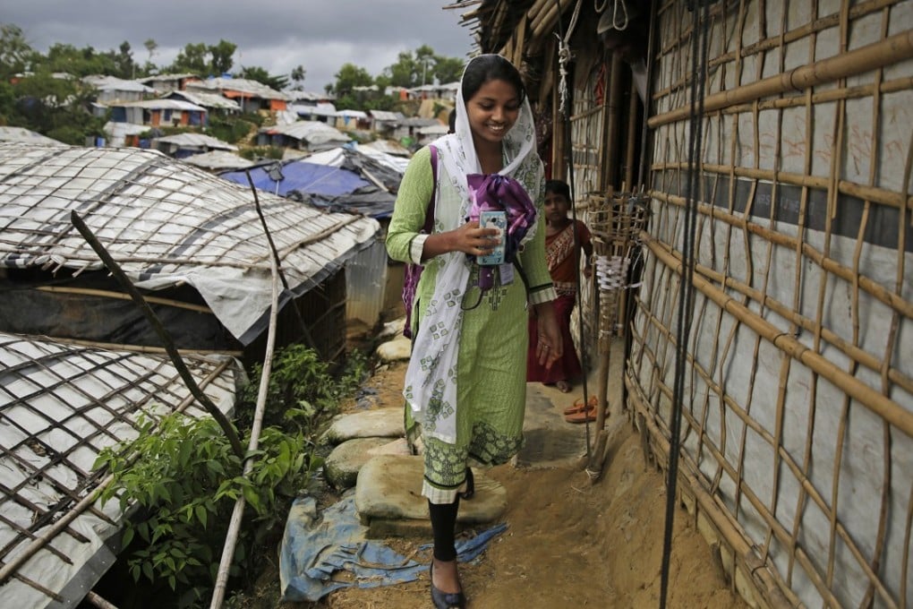 Rahima Akter walks through Balukhali refugee camp in Bangladesh. Photo: AP