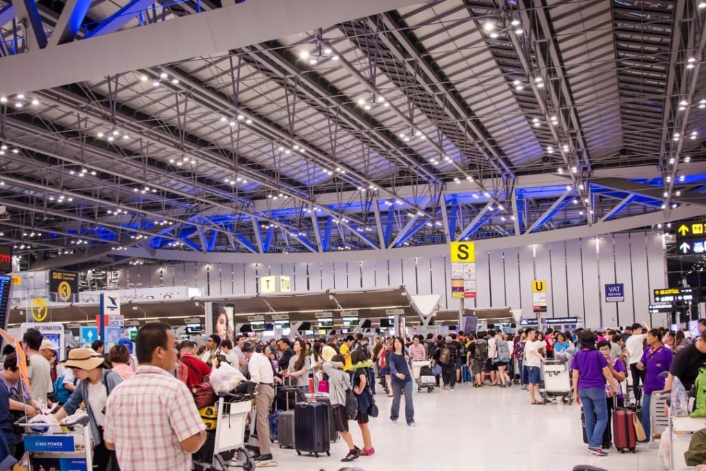 Travellers wait at Suvarnabhumi Airport, one of Bangkok’s two international airports. Photo: Alamy