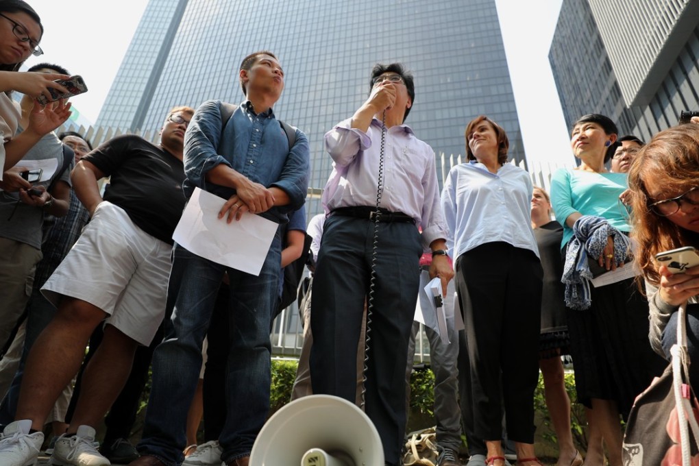 A dozen representatives from six journalists’ groups held a rally outside government headquarters in Admiralty on Tuesday, urging the authorities to give a full explanation of the visa rejection. Photo: Edward Wong