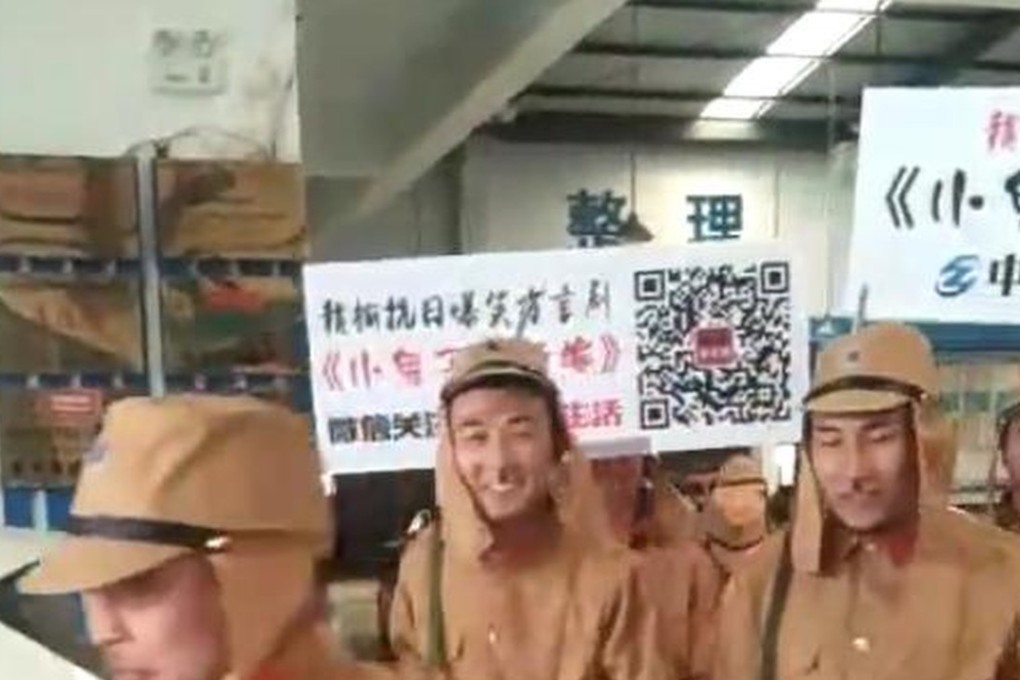 Marchers carried signs promoting a short film and a local car company. Photo: Thepaper.cn