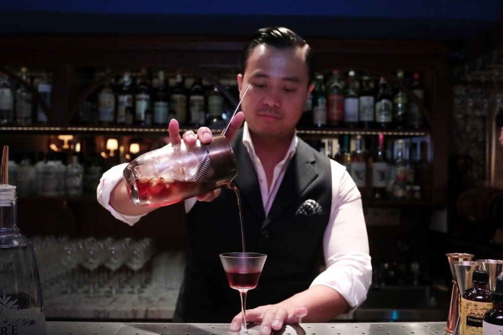 Joe Villanueva mixes a monti-tipple, a cocktail based on the original martinez, at The Wise King, in Central. Picture: Jonathan Wong