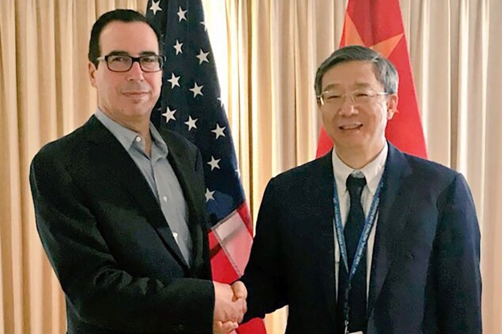 Chinese central bank governor Yi Gang (right) meets US Treasury Secretary Steven Mnuchin on the sidelines of the World Bank annual conference in Bali on Thursday. Photo: Handout
