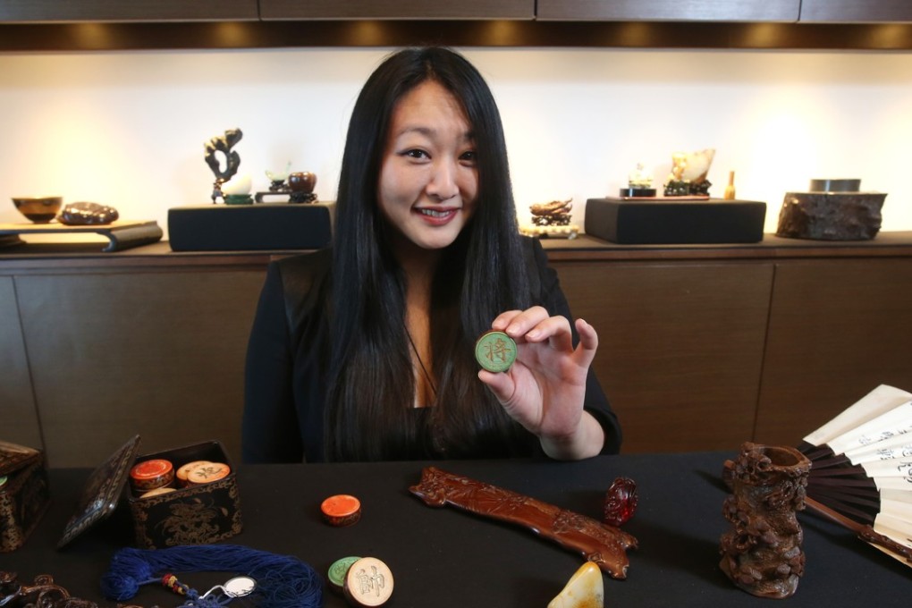 Maria Kiang shows off some Chinese art pieces. Photo: David Wong