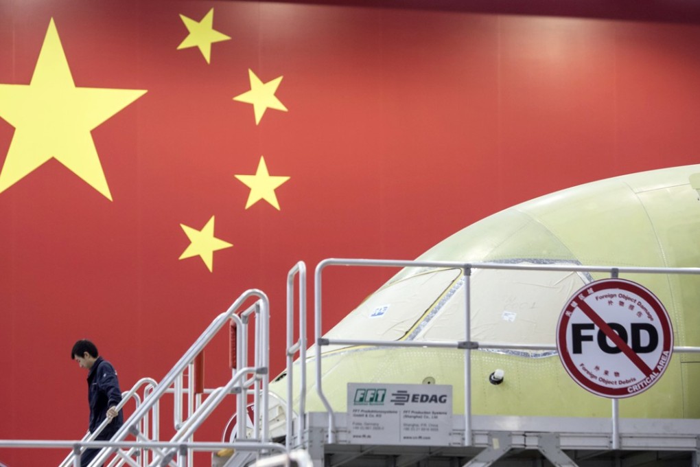 A Comac C919 aircraft under assembly at the company’s facility in Shanghai. The plane is not expected to enter operation until 2021 – six years behind its original delivery date of 2015. Photo: Bloomberg