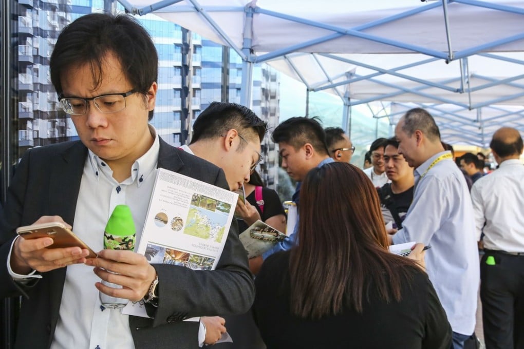 Prospective buyers queue for access to the sales office for Le Pont, a six-tower residential project in Tuen Mun, on October 6, 2018. Photo: Edmond So