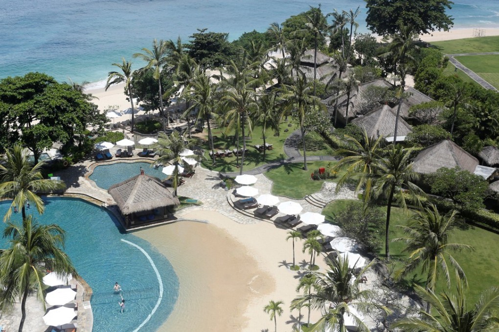 A view of a pool and a beach in the luxury resort area of Nusa Dua on Bali. Leaders, ministers and central bank heads are attending the annual meetings of the IMF and World Bank in Bali this week. Photo: Reuters