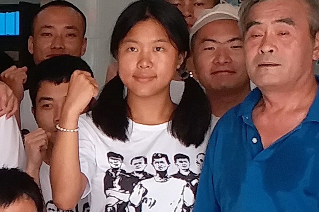 Yue Xin (centre) was taken into custody on August 24 along with about 50 other activists. Photo: Mimi Lau