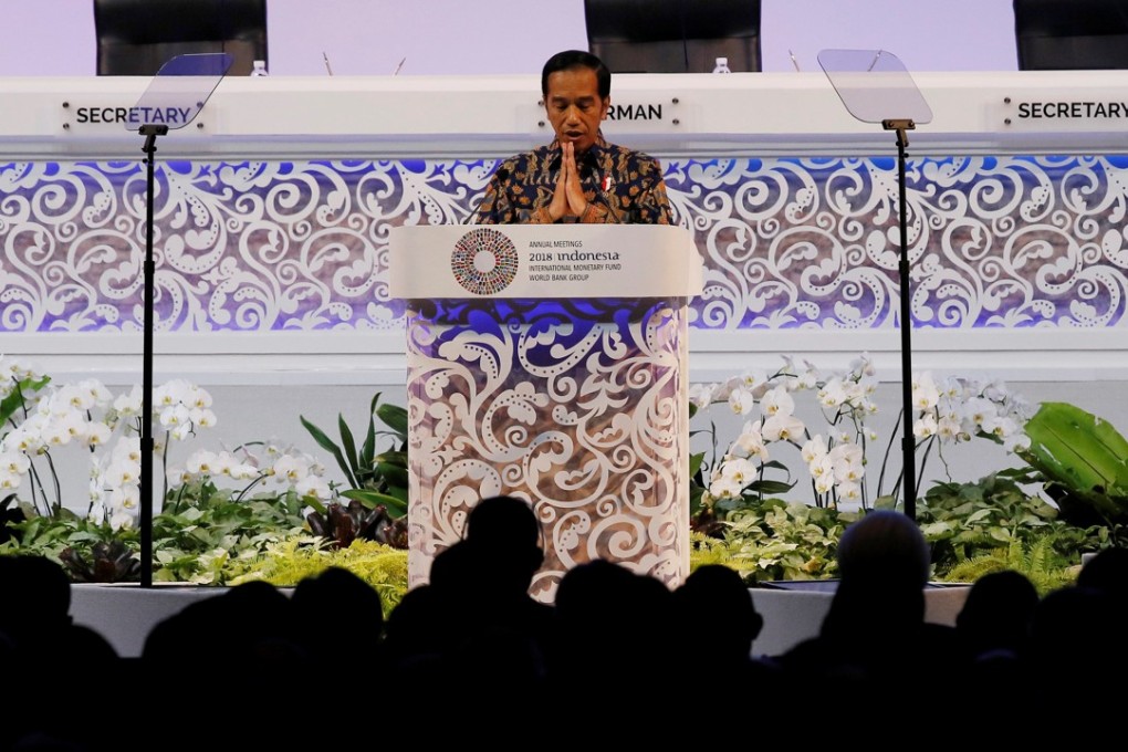Indonesia President Joko Widodo gestures during a speech at a plenary session at International Monetary Fund – World Bank Annual Meeting 2018 in Nusa Dua, Bali, Indonesia on Friday. Photo: Reuters