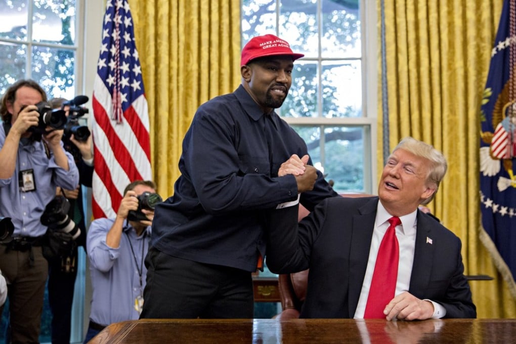 Rapper Kanye West, left, shakes hands with US President Donald Trump during a meeting in the Oval Office of the White House in Washington on Thursday. Photo: Andrew Harrer/Bloomberg