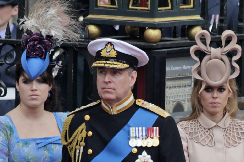 Princess Eugenie (left), who weds on Friday, and Princess Beatrice with their father, Prince Andrew, at the wedding of Prince William and Kate Middleton in 2011. Photo: AP