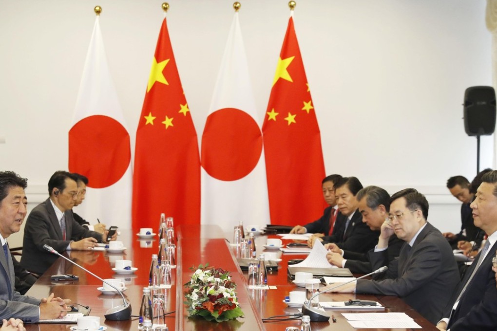 Japanese Prime Minister Shinzo Abe, left, and Chinese President Xi Jinping, second from right, holding talks on the sidelines of the Eastern Economic Forum in Vladivostok, Russia, on September 12. Photo: Kyodo