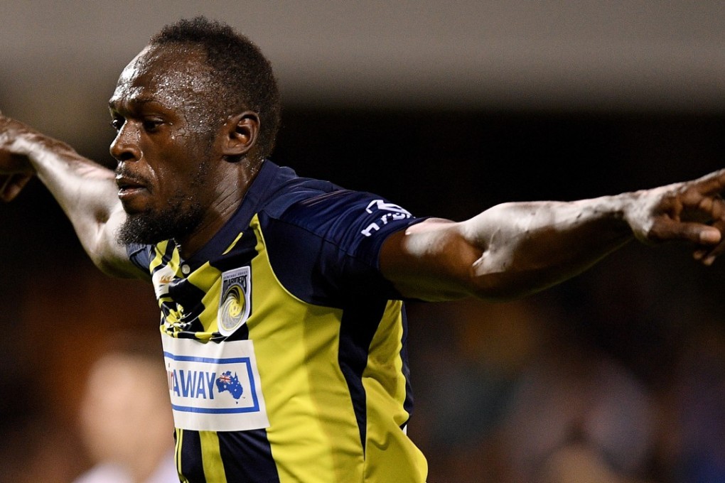 Usain Bolt celebrates scoring for Central Coast Mariners. Photos: EPA