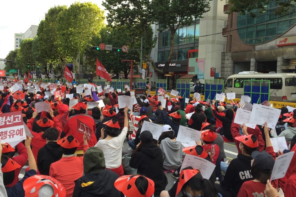 Women protesting against hidden camera pornography in Seoul, South Korea, on October 6, 2018. The sign is mosaiced to obscure a word some may find offensive. Photo: SCMP/Crystal Tai