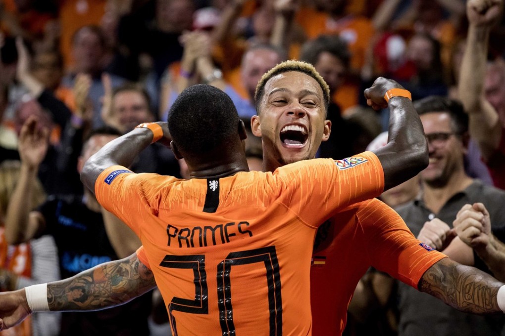 Memphis Depay (right) of the Dutch national team celebrates his goal with teammate Quincy Promes during the Uefa Nations League win over Germany. Photo: EPA