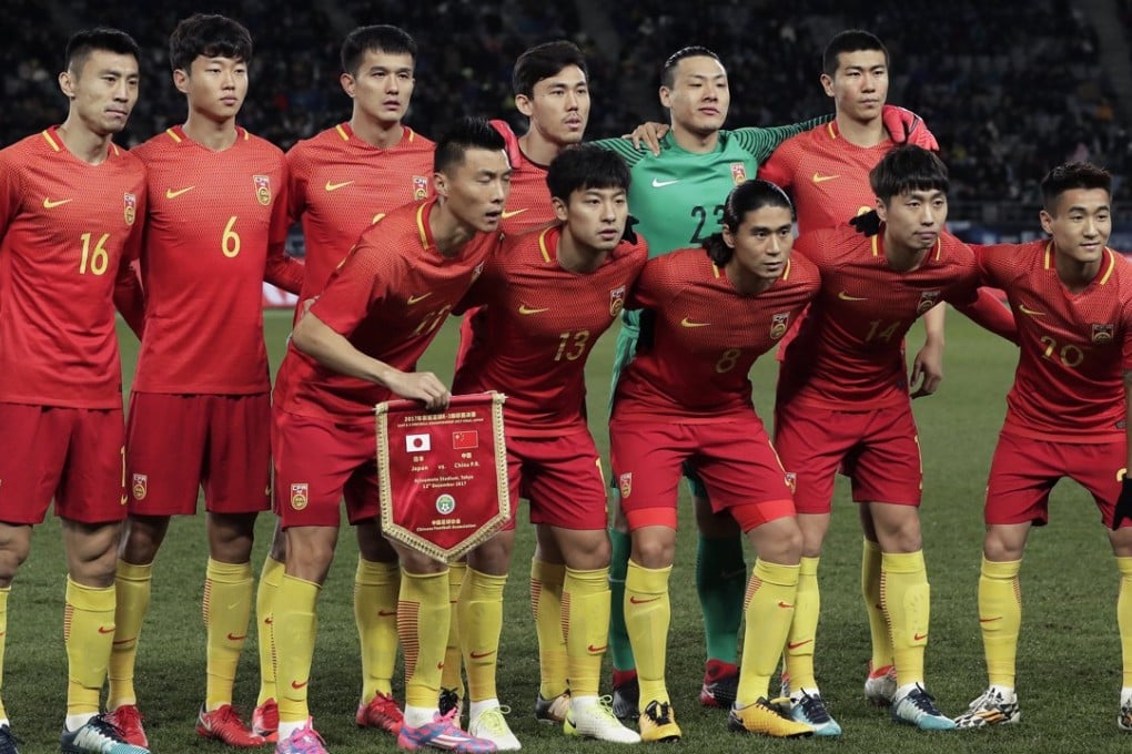 China line-up for a family against Japan last December. The Asian Cup is the next big challenge for China, but how prepared will they be? Photo: EPA