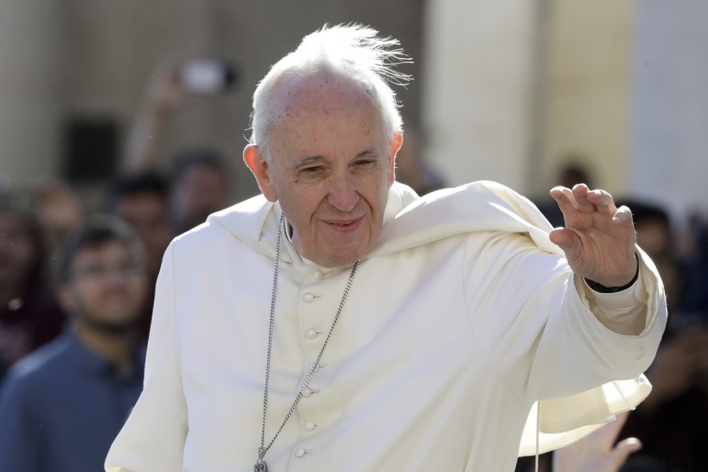 Pope Francis arrives for his weekly general audience in St. Peter's Square at the Vatican. South Korea says North Korean leader Kim Jong-un wants Pope Francis to visit North Korea. Photo: AP