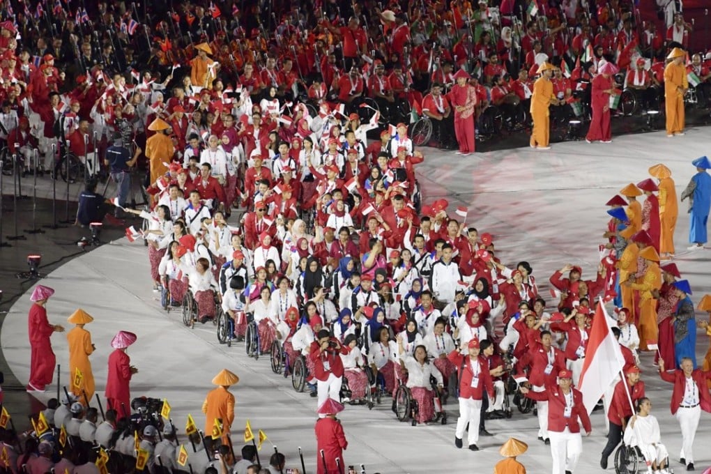 Indonesian athletes enter the Gelora Bung Karno Stadium in Jakarta for the opening ceremony of the Asian Para Games. Photo: Kyodo