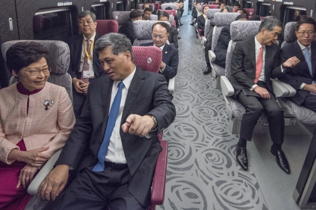 Hong Kong leader Carrie Lam (left) and other senior officials take an express train on September 22 during opening celebrations for the high-speed rail line. Photo: ISD