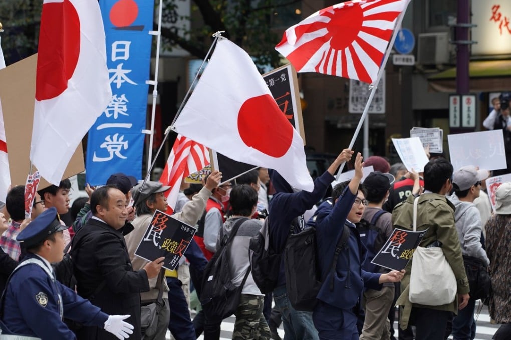 Demonstrators at a rally against Japan Prime Minister Shinzo Abe’s proposed legislation regarding foreign workers. Photo: Bloomberg