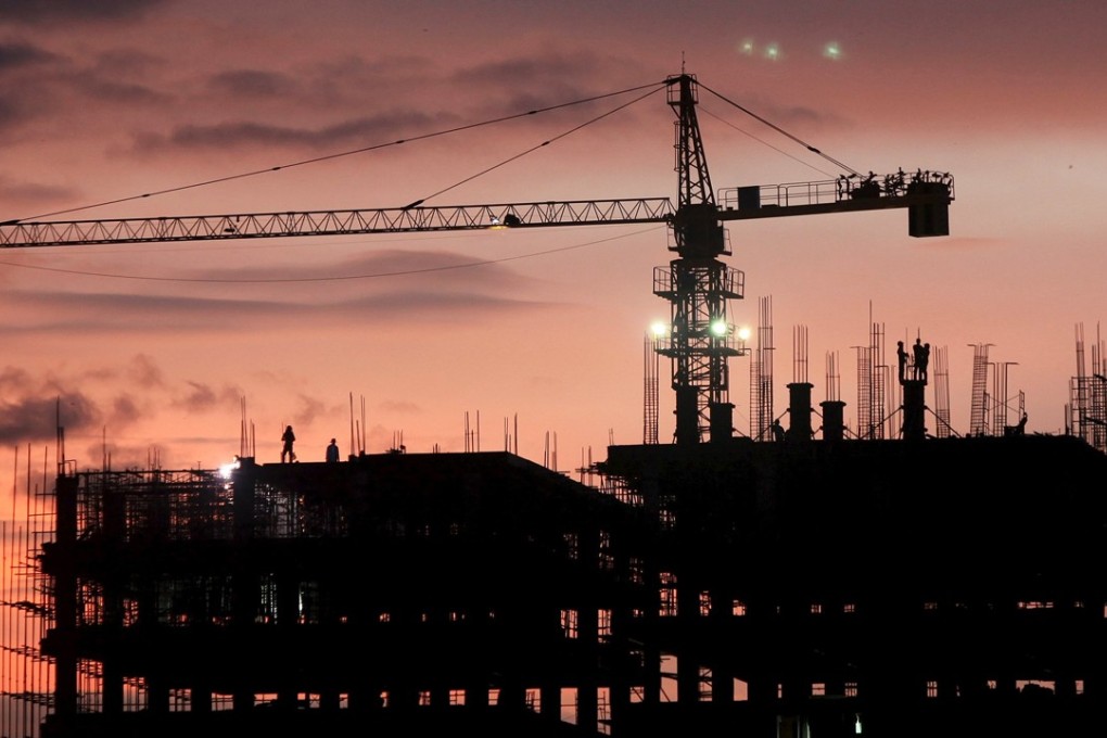 Labourers work at a construction site on Koh Pich island in Phnom Penh. Photo: Reuters