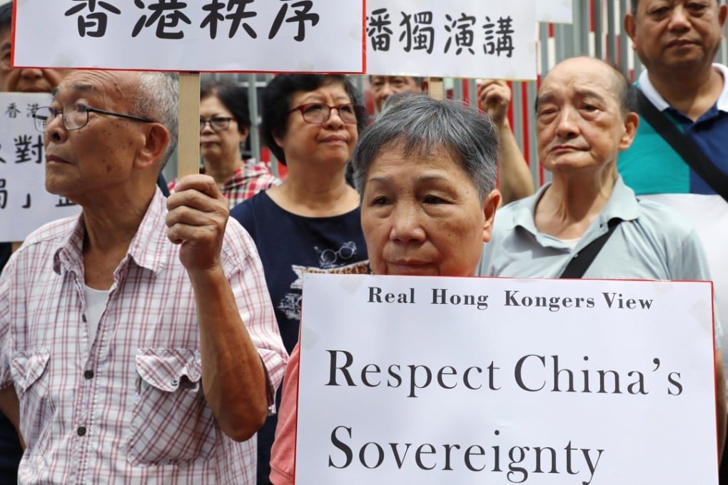 A pro-Beijing group protests against the talk on independence by Andy Chan Ho-tin, convenor of the Hong Kong National Party, at the Foreign Correspondents’ Club in Central on August 15. Photo: Sam Tsang