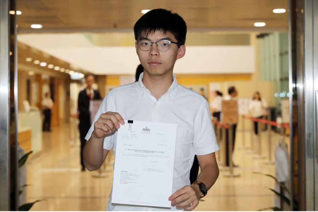 Joshua Wong with the written judgment. Photo: Sam Tsang