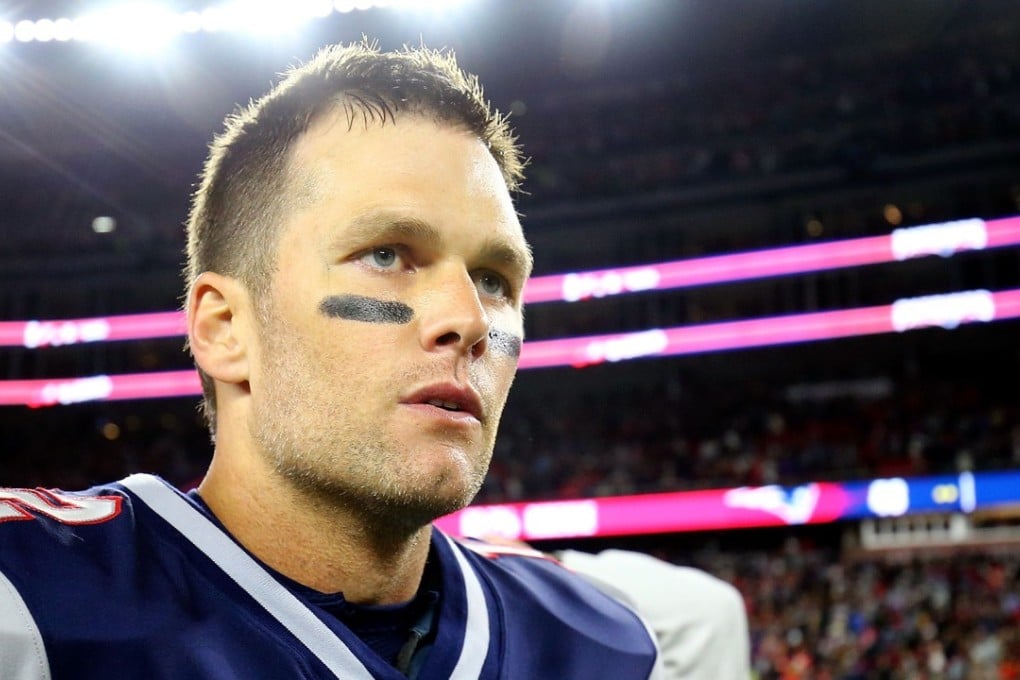 Tom Brady of the New England Patriots exits the field after victory over the Kansas City Chiefs. Photo: AFP