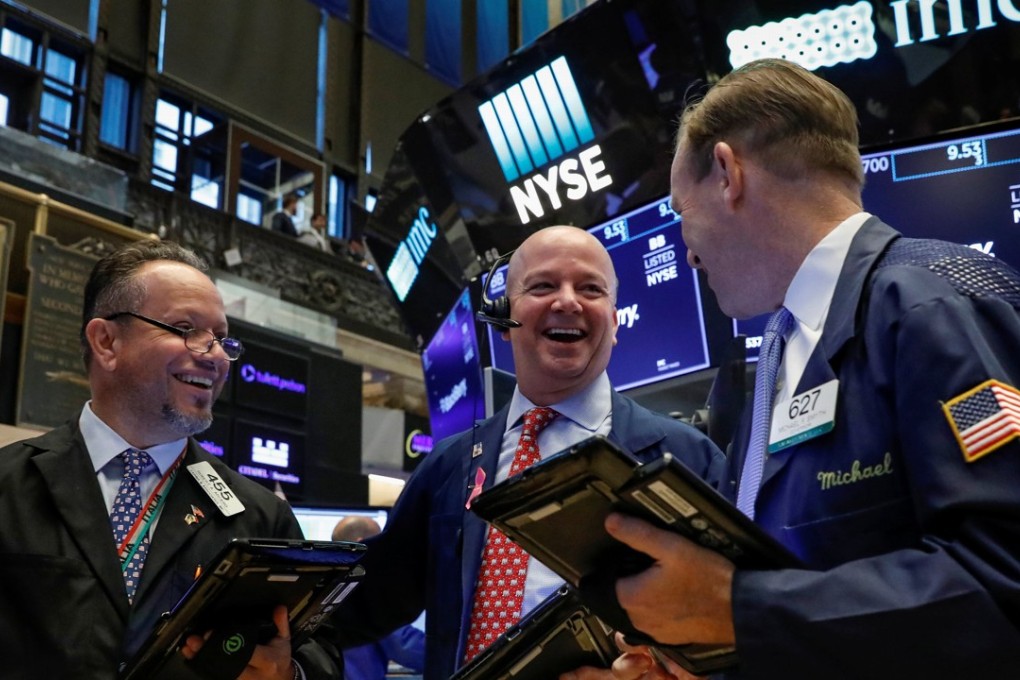 Traders work on the floor of the New York Stock Exchange on Tuesday, when the Dow rose nearly 550 points. Photo: Reuters