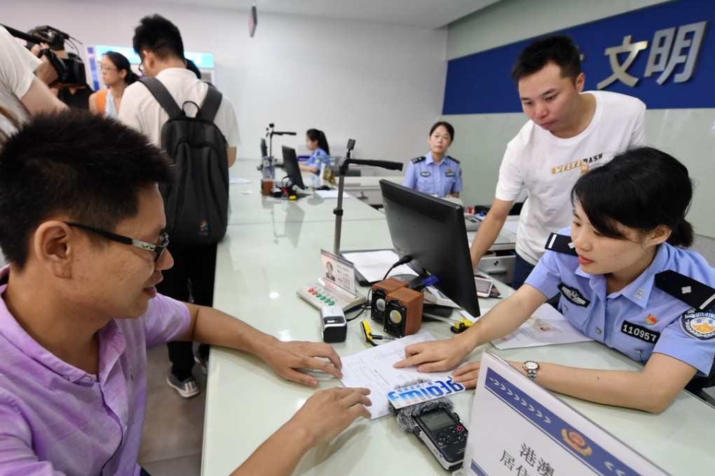 An applicant from Taiwan applies for a mainland residence permit in the southeastern city of Fuzhou in September. Photo: Xinhua