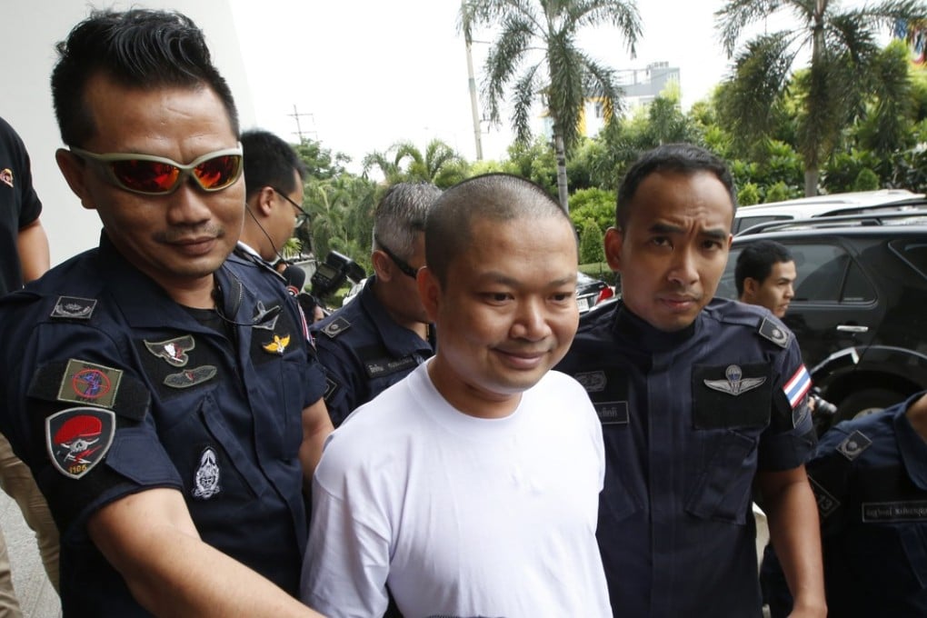 Ex-monk Wirapol Sukphol is escorted to the prosecutor's office in Bangkok in 2017. Photo: AP