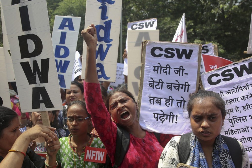 Women activists shout slogans condemning the rape of a nineteen-year old girl while protesting in New Delhi, India, in September. Photo: AP