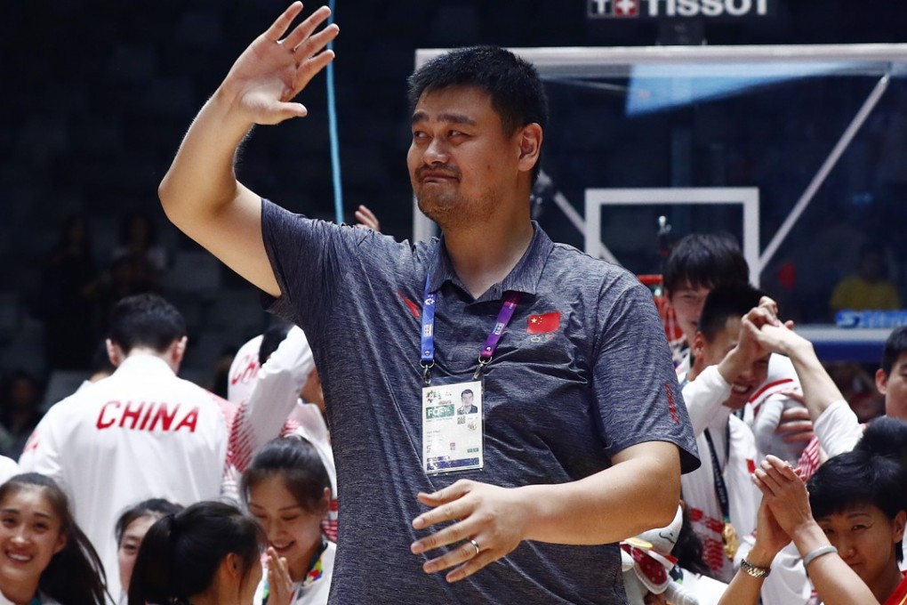 Former China basketball star Yao Ming joins Team China on the podium at the Asian Games in Jakarta. Photo: EPA