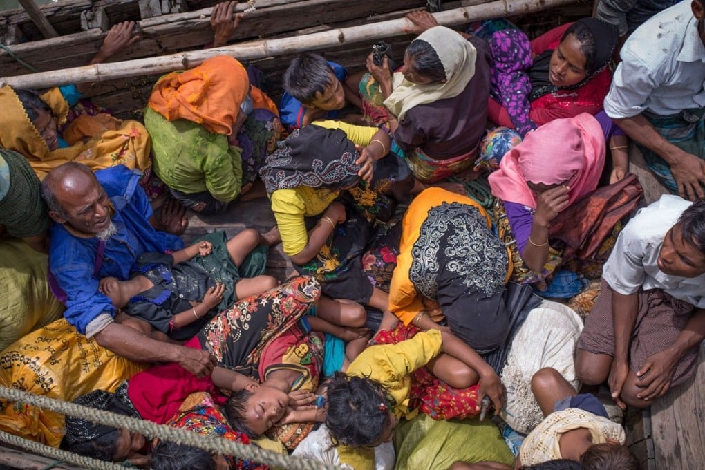 Rohingya refugees arriving by boat at Shah Parir Dwip on the Bangladesh side of the Naf River after fleeing violence in Myanmar. Photo: AFP