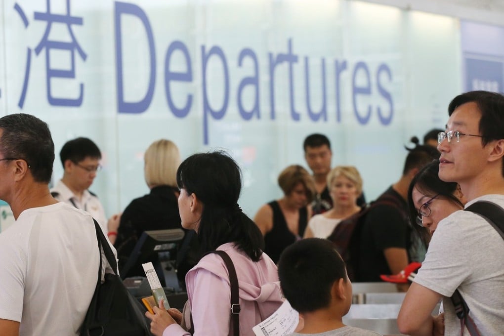 Passengers lining up at departures in Hong Kong International Airport, Chek Lap Kok. Photo: David Wong